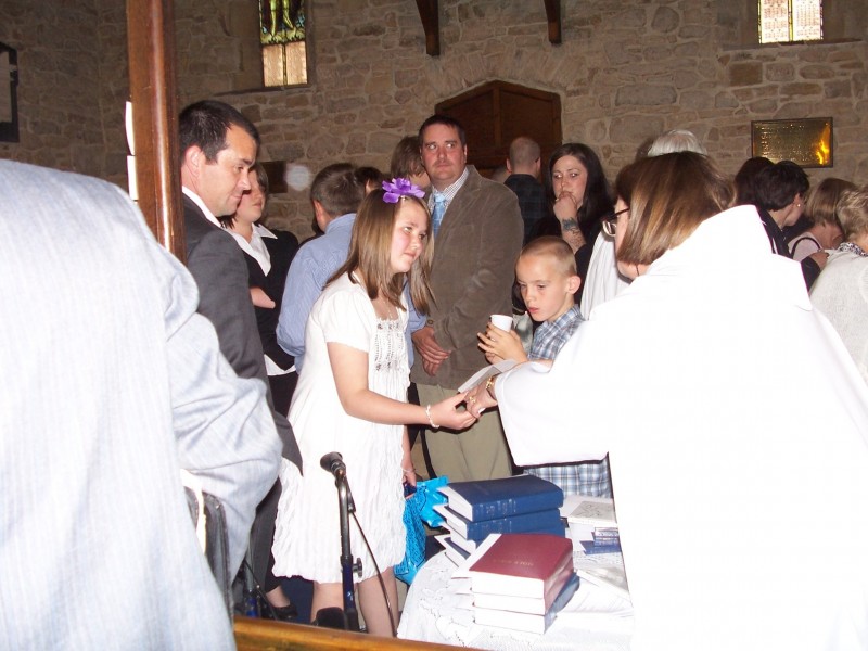 Revd Jan presents a prayer book to Lisa-Marie