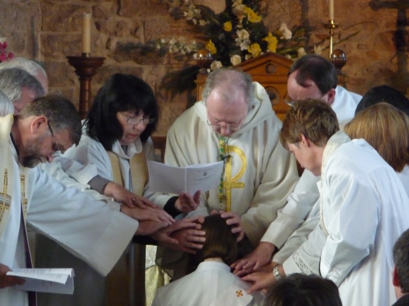 The laying on of hands during the Priesting Of Tessa